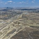 Earthworks and bridge construction for the future system interchange at Highway 8 / Sarcee Trail / Glenmore Trail (looking east)