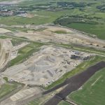 Crushing operations, the south asphalt plant and gravel stockpiles near Highway 22X, with Spruce Meadows in the background (looking southeast)