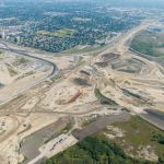 Bridge construction, earthworks and utility installations sharing space at the Sarcee Trail interchange (looking northeast)