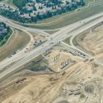 Bridge piers and retaining walls taking shape at 37 Street and 130 Avenue / Buffalo Run Boulevard (looking southeast)