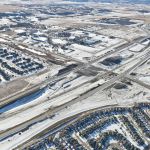 Snow covering earthworks at the intersection of Highway 22X and James McKevitt Road / Spruce Meadows Way (looking southwest)