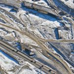 The new bridge from southbound Sarcee Trail to westbound Highway 8 next to existing traffic (looking southeast)