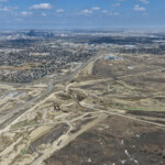 Earthworks and bridge construction for the future system interchange at Highway 8 / Sarcee Trail / Glenmore Trail (looking east)