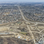 Earthworks for the Anderson Road system interchange, as well as the KGL site office and Tsuut'ina Nation Admin Building (looking east)