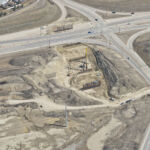Driven piles for the new bridge at Buffalo Run Boulevard / 130 Avenue and 37 Street (looking east)