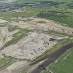 Crushing operations, the south asphalt plant and gravel stockpiles near Highway 22X, with Spruce Meadows in the background (looking southeast)