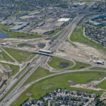 Ongoing bridge construction and earthworks at the Macleod Trail interchange (looking northwest)