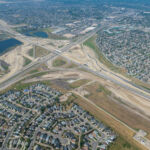 Paving the new detour from westbound Highway 22X to northbound Macleod Trail (looking northwest)