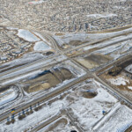 Piling and earthworks at the intersection of Highway 22X and James McKevitt / Spruce Meadows Way, with stormwater ponds to the left of the photo (looking northeast)