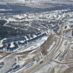 View of the Highway 8 corridor, with a stormwater pond taking shape near Discovery Ridge (looking southwest)