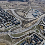 The intersection at Glenmore Trail and 37 Street, with Grey Eagle Boulevard and the Grey Eagle Resort and Casino in the background (looking southwest)