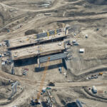 Placing girders on three bridges in the Sarcee Trail interchange (looking south)